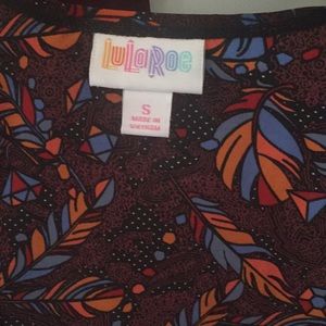 LuLaRoe.Great for holiday. Sleeveless scarf fabric